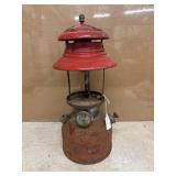 Vintage red Coleman Model 200A single-mantle