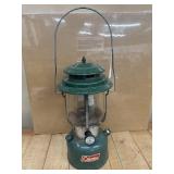 Vintage green Coleman double-mantle gas lantern,