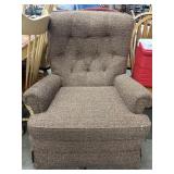 vintage brown tweed armchair featuring a tufted
