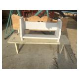 Small, handmade wooden bench featuring a
