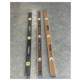 Three 4 ft. vintage wooden levels.