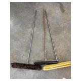 3 Long-handled floor push brooms.