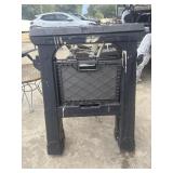 2 Black plastic folding sawhorses with an