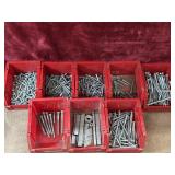 Assorted screw bundle in red containers.