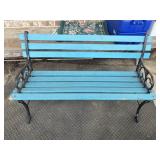 Classic outdoor park bench featuring a black