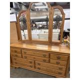 Wide golden oak wood dresser with an attached