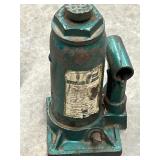 Vintage green hydraulic bottle jack