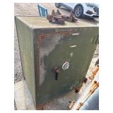 Vintage green metal combination floor safe.