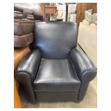 Oversized black leather club chair with rounded