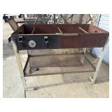 Custom-built, heavy-duty metal charcoal grill or