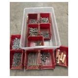 Various metal fasteners like screws, nails, and