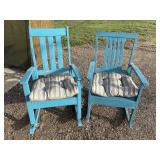 Turquoise-painted wooden rocking chairs outfitted
