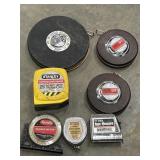 7 pc. vintage Lufkin 50-foot steel measuring tape