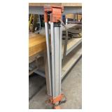Heavy-duty aluminum surveying tripod.