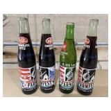 4 Vintage 16-ounce commemorative soda bottles