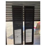 2 Tall, dark-painted wooden fixed louvered