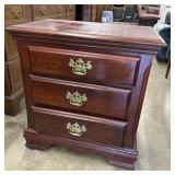 Traditional cherry wood three-drawer nightstand