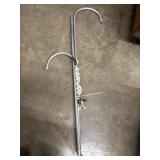 Coleman lantern hanger with hooks.