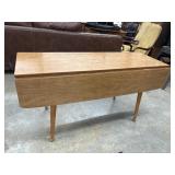 Vintage wooden drop-leaf table with turned