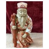 Cermaic figurine of an Asian deity