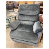 Plush, blue-gray velvet recliner.