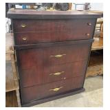 Vintage wooden jewelry armoire featuring a