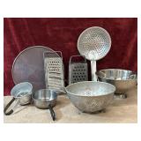 8 pc. metal graters, colander, skimmer spoon,