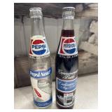 2 Vintage 16 fl. oz. commemorative glass bottles