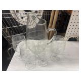 Glass water pitcher and 4 water goblets.