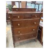Antique dark wood chest of drawers.