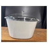 White CorningWare covered casserole dish with a