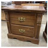 Vintage solid oak two-drawer nightstand.