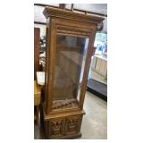 Tall, wooden Oak Gun Cabinet with a glass display