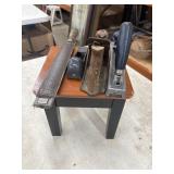 Vintage woodworking hand tools resting on a small