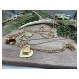 Gold-tone costume jewelry pieces, including a