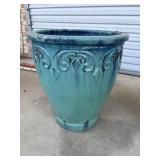 Vibrant turquoise glazed ceramic planter.