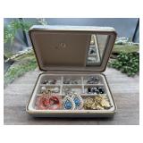 Compact jewelry case filled with an assorted