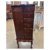 Dark wood Powell Jewelry Armoire.