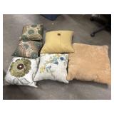 6 Decorative throw pillows in various colors,