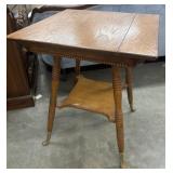 Antique Victorian oak, two-tier parlor table.