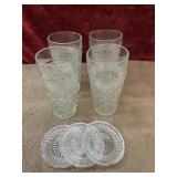 7 pc. clear glass tumblers and glass coasters.
