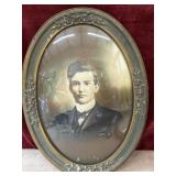 antique oval portrait young man with convex