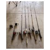 Assorted fishing poles and reels