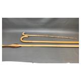 A bamboo and wooden MCM walking canes