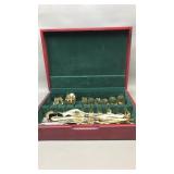 Gold tone stainless steel cutlery in a box