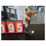 clown with violin sculpture