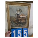 gold frame with print of woman with 2 cows