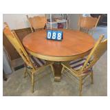 round white oak table and 6 chairs.