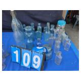 antique glass bottles some with names