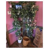 2 artificial trees with items in them